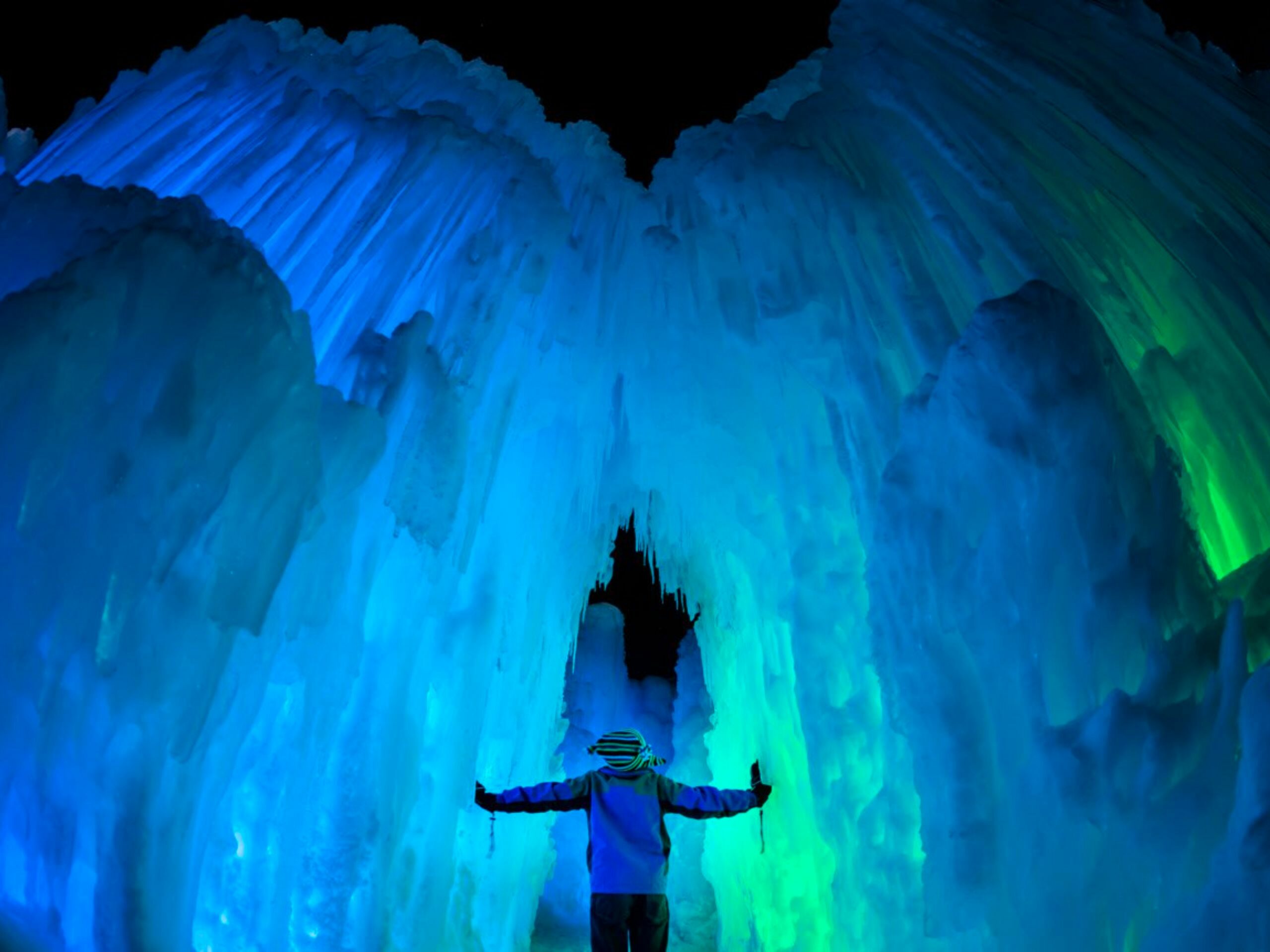 person standing in ice castle