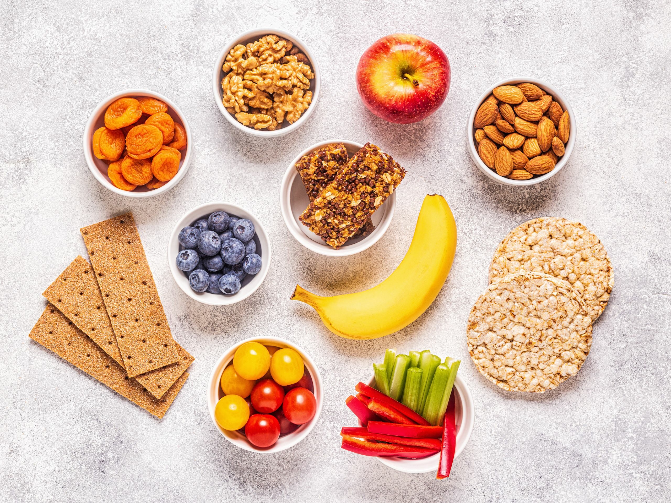 snacks for holiday guests laid out on the table, apple, dried fruits, rice cakes, vegetables
